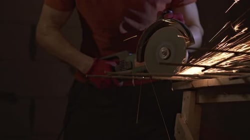 The Master Cuts The Reinforcement With An Angle Grinder.