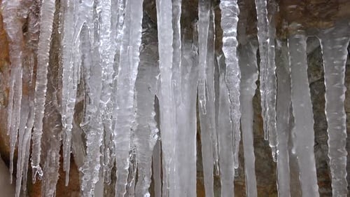 Ice Icicles on Rocky Wall