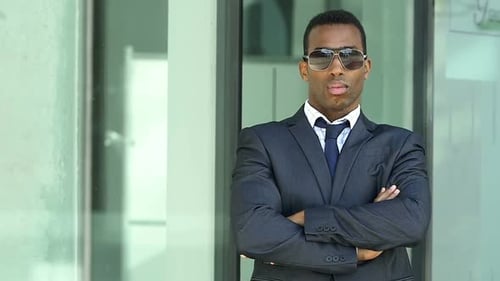 serious african businessman crossing his arms-Success, Business, Leadership - slow motion