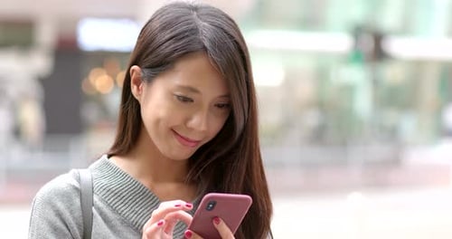 Woman Using Phone in City, Close Up