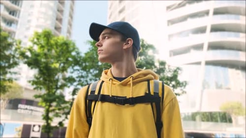 Confident Young Adult Standing Tall in City