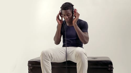 Young Adult Listening to Music on Headphones
