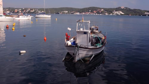 Fishing Boat Moored on Calm Coastal Waters