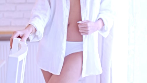 Blonde Woman Posing Seductively in Unbuttoned Shirt