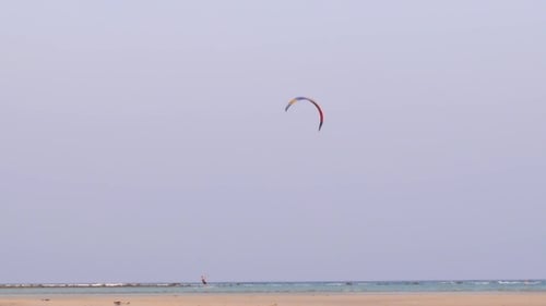 Kite Surfer In The Sea At The Beach