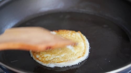 Pancake being cooked in a frying pan