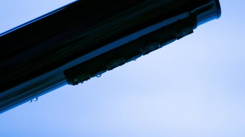 Water Flowing from a Chrome Shower Head