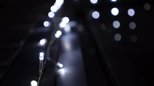 Abstract White Christmas Lights Glowing in the Dark