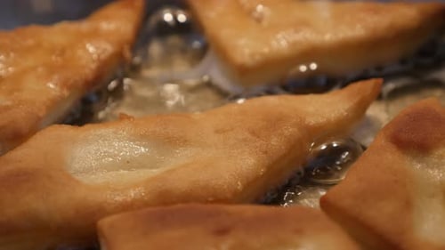Sunflower oil and fried buns unhealthy food background 3840X2160 UltraHD footage - Dough made Piro