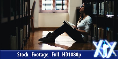 Female Student Studying In Library