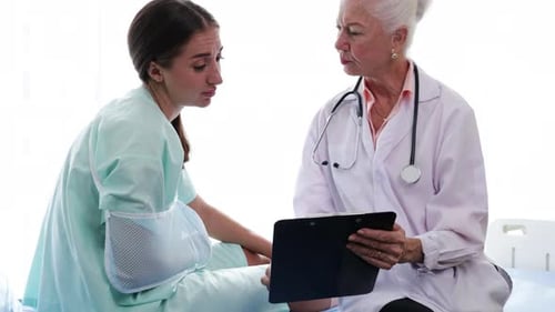 Doctor Explains Diagnosis to Patient in Hospital