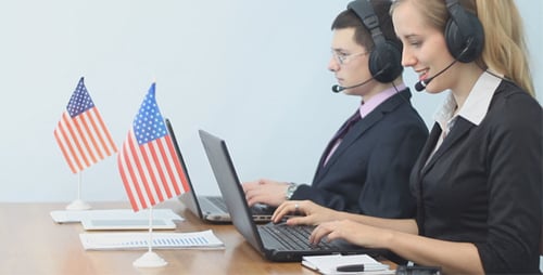 American Call Center Operators Working with Laptop
