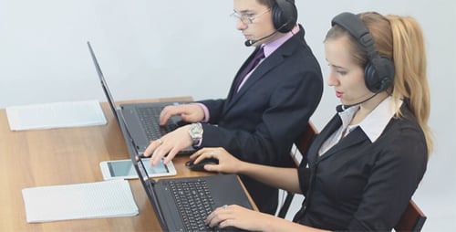 Call Center Operators Using Laptops and Tablets