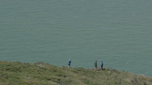 People Watch At The Ocean