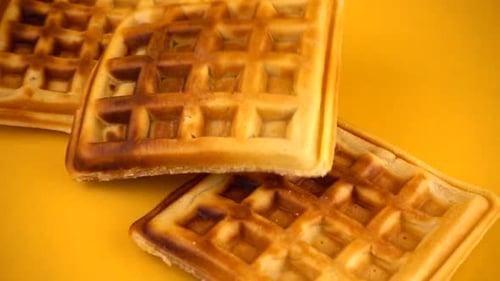 Waffles Falling on a Yellow Background