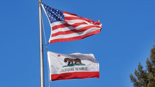 American and California Flags Waving in the Wind