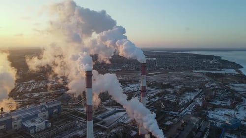 Plant pipes pollute atmosphere. Industrial factory air pollution
