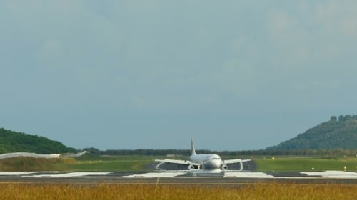 Airplane Landing on Runway at Airport