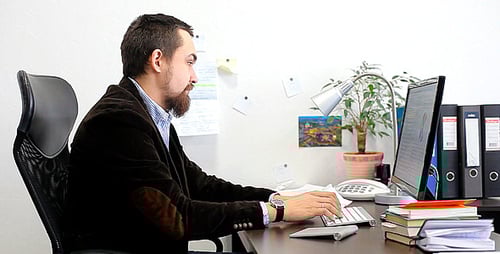 Businessman Working on the Computer in the Office