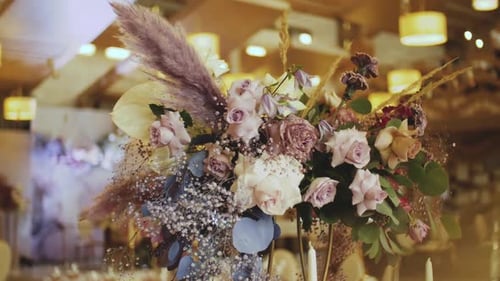 Elegant Floral Wedding Centerpiece with Roses and Plumes