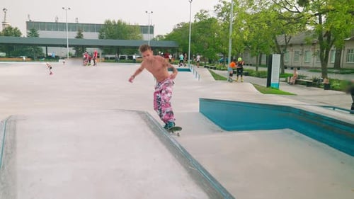 Young Man Skateboarding in Urban Skatepark
