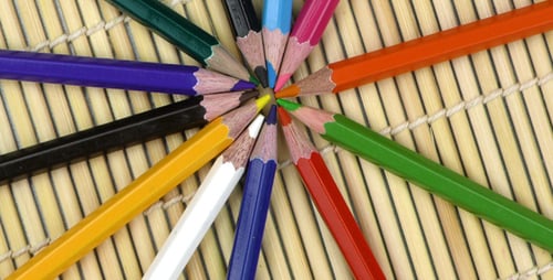 Circular Array of Vibrant Colored Pencils on Mat