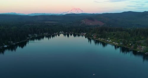 Mount Rainier Vibrant Sunset Boats In Lake Aerial Drone View
