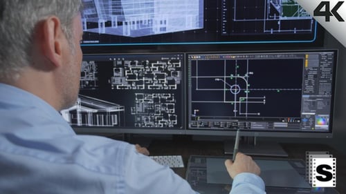 Architect Designs Building on Computer with Stylus