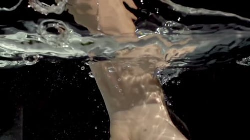 Fair Arm Fist Plunges Forcefully into Water