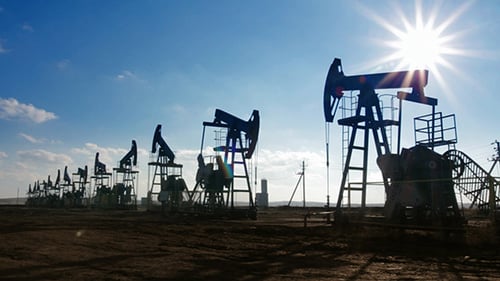 Oil Pump Jacks Extracting Resources on Sunny Day