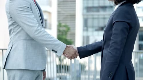 Business Handshake Deal on Balcony Outdoors