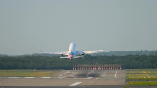 Airplane Takes off on Runway During the Day