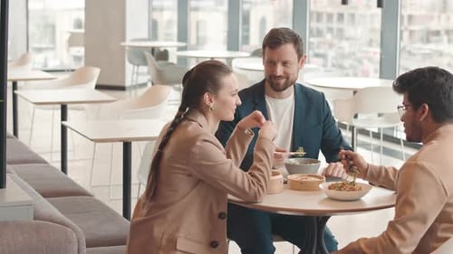 Coworkers Having Lunch Together at Food Court