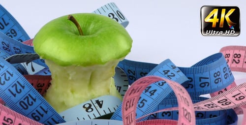Apple Core Surrounded by Measuring Tape