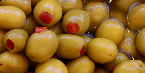 Shiny Green Olives with Red Pimento Close Up