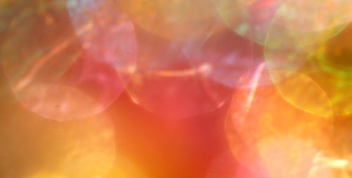 Abstract Bokeh Background with Shifting Iridescent Orbs