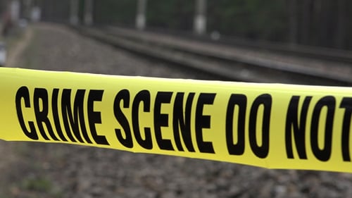 Crime Scene Tape Blocking Railroad Tracks