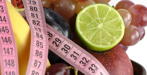 Fresh Fruit and Measuring Tape Close Up