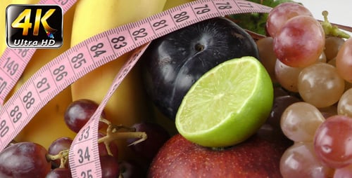 Fresh Fruits and Tape Measure for Dieting
