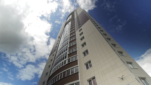 Modern Building On A Background Of Clouds Drifting