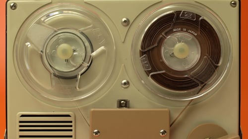Vintage Reel-to-Reel Tape Recorder Playing Audio