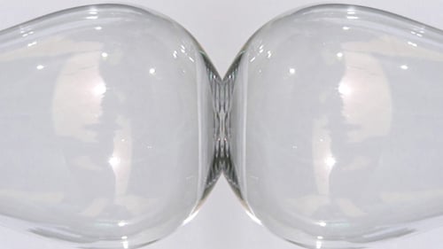 Colorful Liquid Being Poured Into Wine Glasses