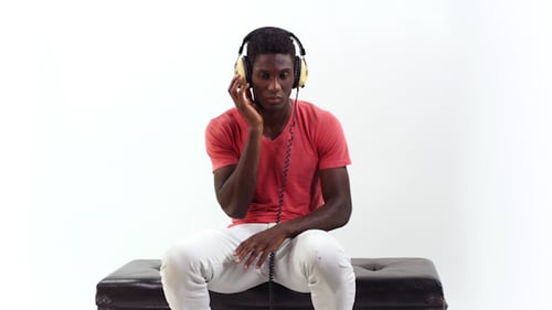 Young Man Listening to Music on Headphones