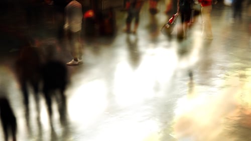 Blurred View of People Walking in City