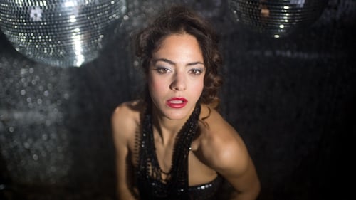 Glamorous Woman Dancing with Disco Balls