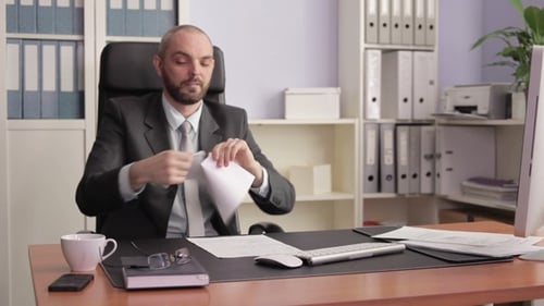 Men in Suits Shake Hands in Office