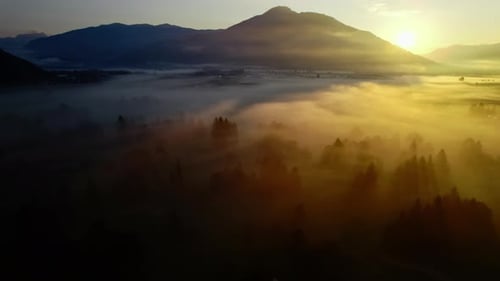 Sunrise Over Misty Mountain Landscape