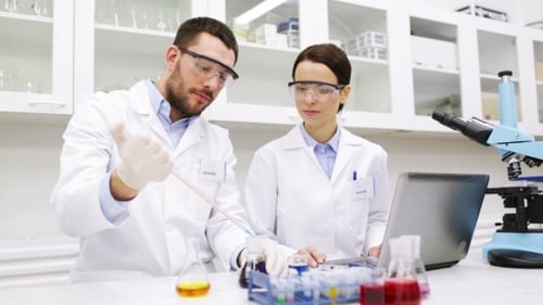 Young Scientists Making Test Or Research In Lab