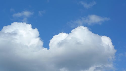 Clouds Time-Lapse Across a Blue Sky