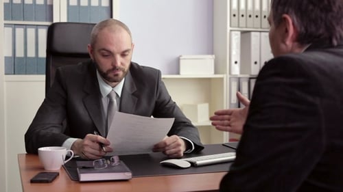 Businessmen Meeting in Office Signing Contract